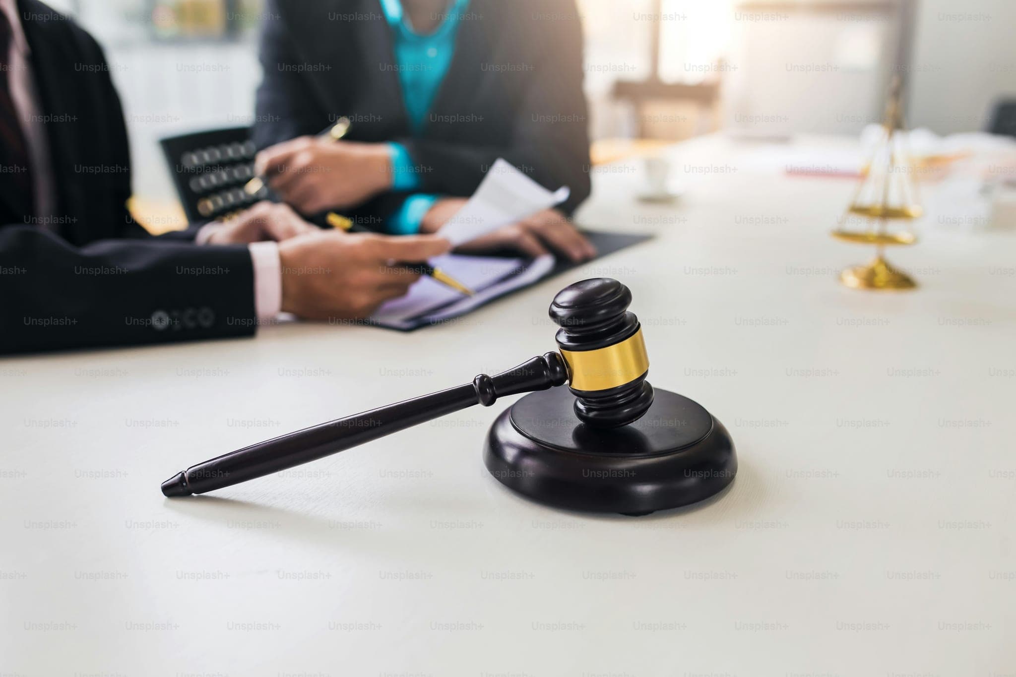 Team of lawyers man working together on legal matters in the office.