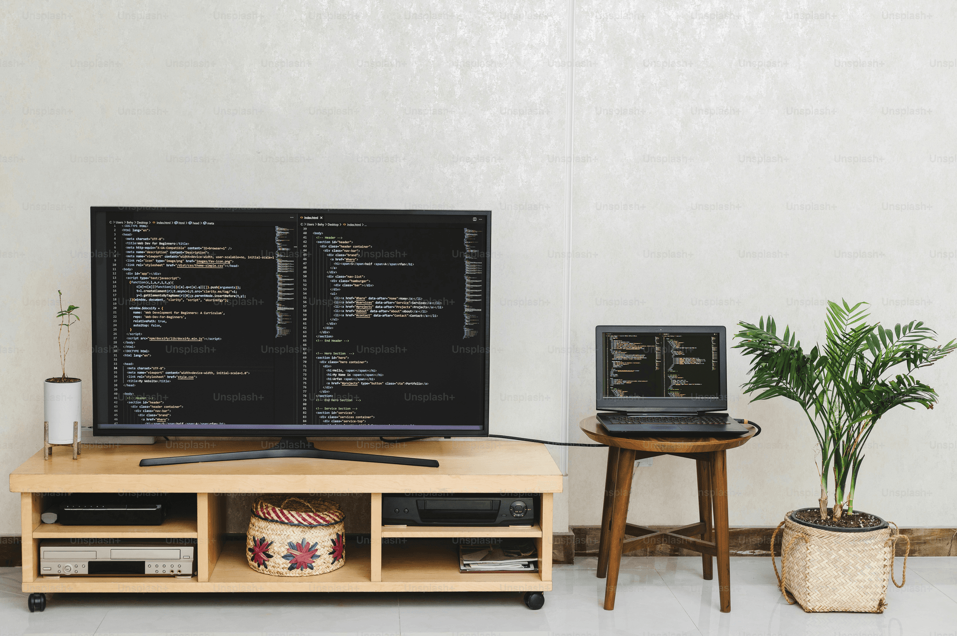 a flat screen tv sitting on top of a wooden stand