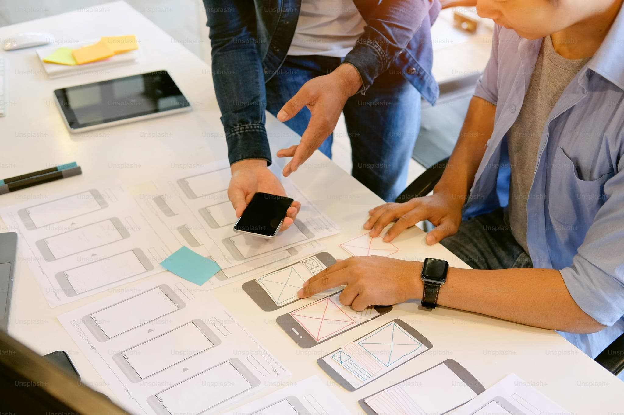Programer Team working development software with UX UI project in computer and paper project.
